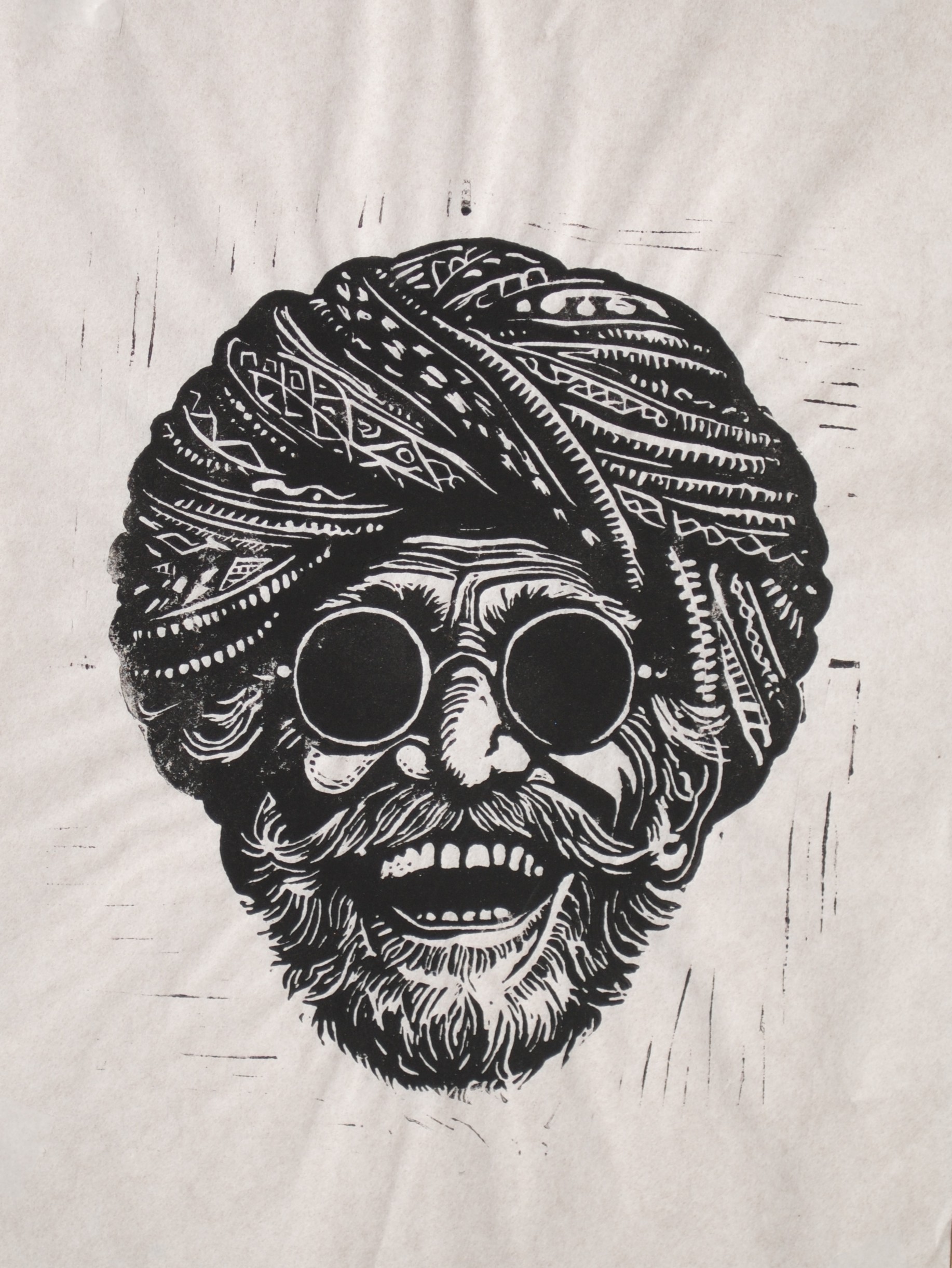 Jaipuri — a man in a turban and spectacles